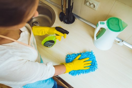 Carpet cleaning technician preparing safe equipment and workspace