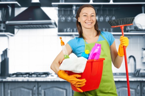 Cleaner refreshing floors and surfaces in a Tooting property after a deep clean