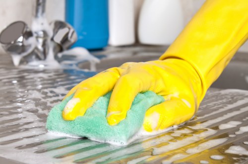 Professional cleaner vacuuming a shared office space in Tooting